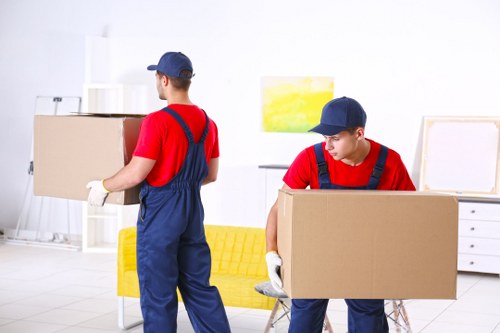 Removal van staff preparing a move with safety checks