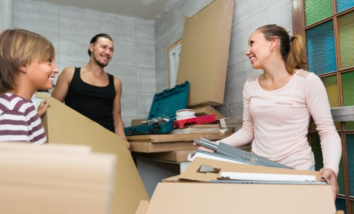 Removals team loading furniture for a same day move in West Kensington