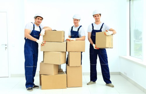 Professional movers loading items for a flat removal in West Kensington