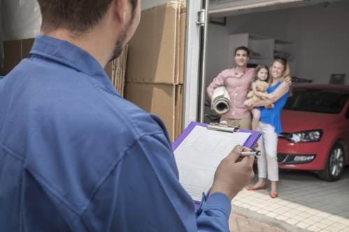 Office move setup with labelled boxes and furniture delivery in West Kensington