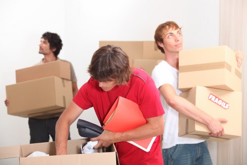 Careful loading of household items for a West Kensington move