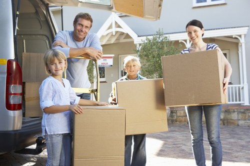 Van loading boxes and household items for a West Kensington move