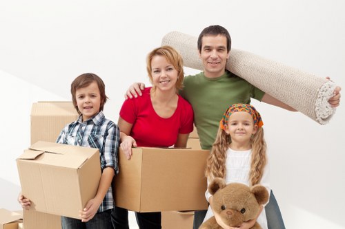 Packed moving boxes inside a West Kensington removal van