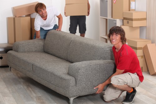 Professional movers handling office furniture and equipment in West Kensington