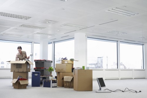 Packed boxes and furniture ready for local removals in West Kensington