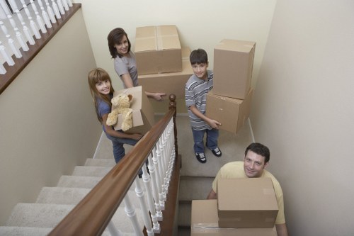Removal vehicle and movers coordinating access in West Kensington